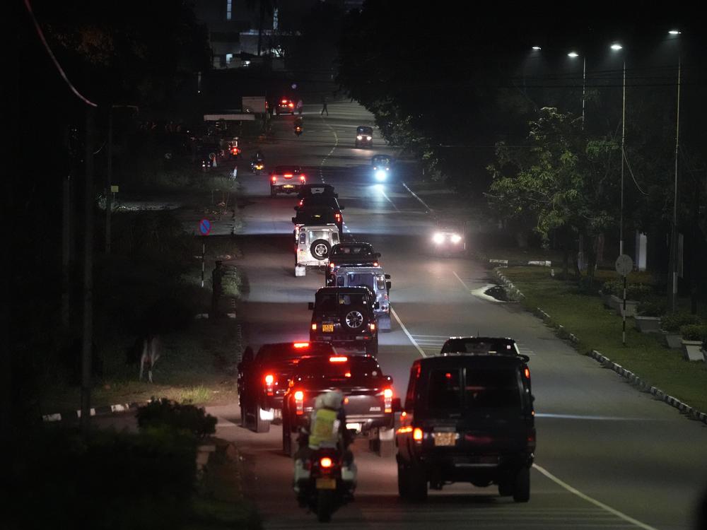 A motorcade believed to be conveying Sri Lanka's former president, Gotabaya Rajapaksa, leaves the Bandaranaike International airport in Colombo, Sri Lanka, on Saturday.
