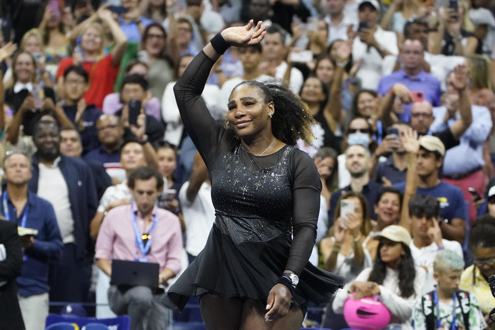 Serena Williams waves to fans after losing to Ajla Tomljanovic in the third round of the U.S. Open tennis championships on Friday in New York.