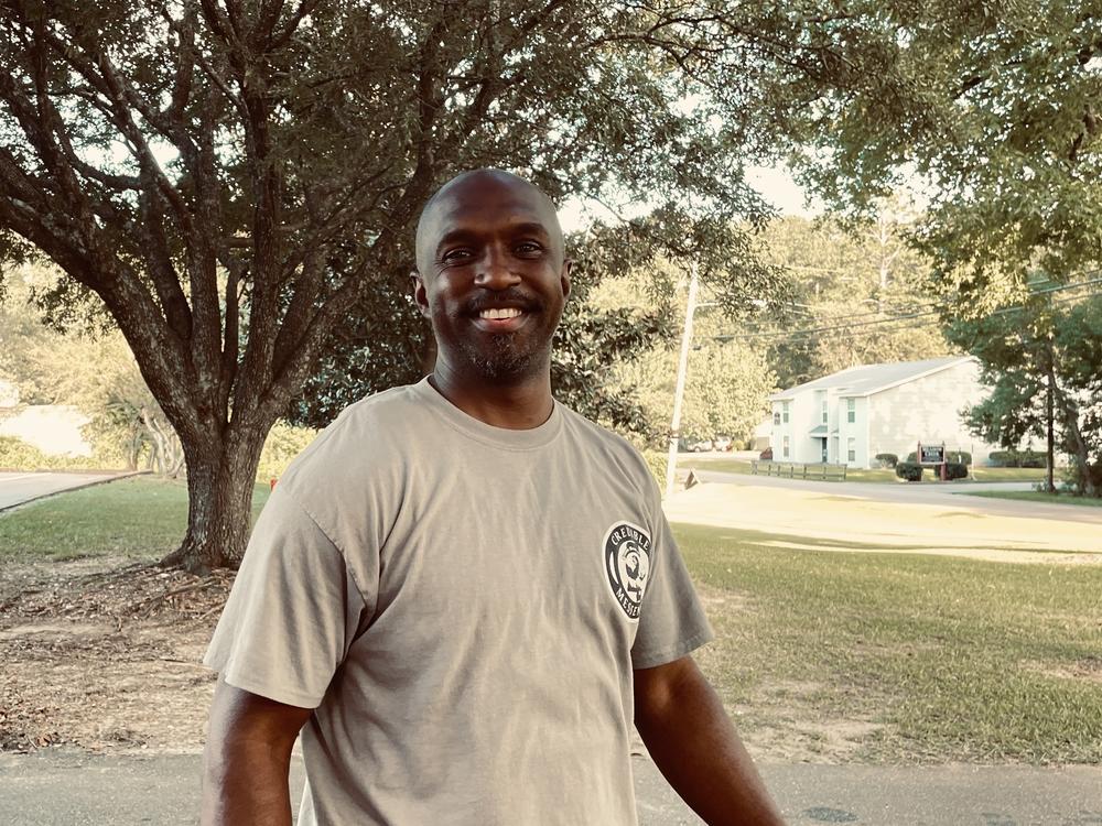 Jason Page is a youth mentor with the group Strong Arms. He helps distribute water at the Sykes Community Center.