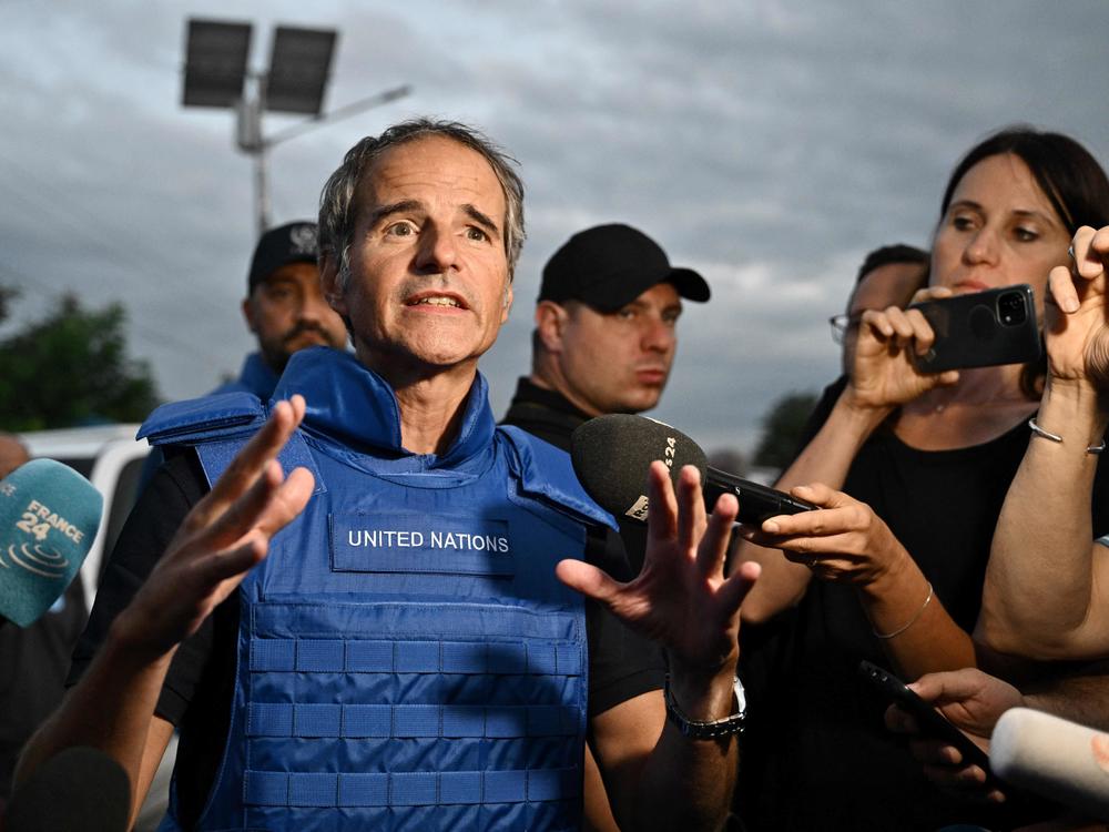 International Atomic Energy Agency chief Rafael Mariano Grossi talks to reporters on a road outside the city of Zaporizhzhia after his visit to the Russian-held Zaporizhzhia nuclear power plant in southern Ukraine on Sept. 1, amid the Russian invasion of Ukraine.