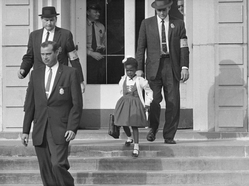 U.S. deputy marshals escort six-year-old Ruby Bridges from William Frantz Elementary School in New Orleans in November 1960.