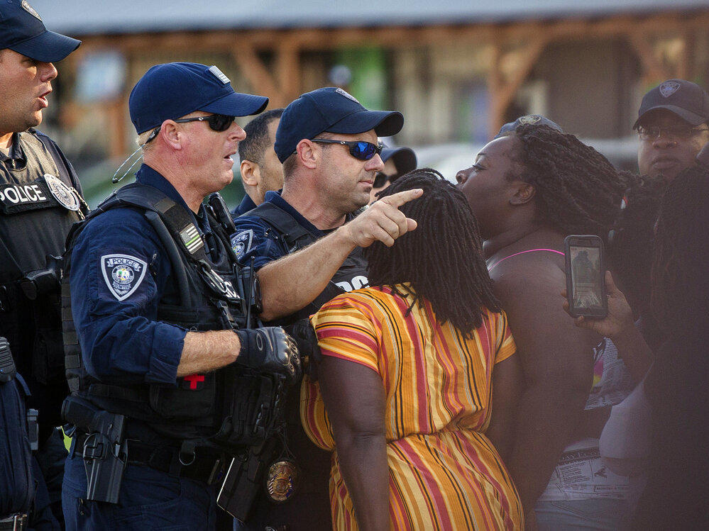 Brittany Martin, center,  confronts police as demonstrators march in protest of George Floyd's death May 2020 in downtown Sumter, S.C. Martin, a pregnant Black activist serving four years in prison for her behavior at racial justice protests, is scheduled to have her sentence reconsidered as she struggles to reach her due date behind bars.