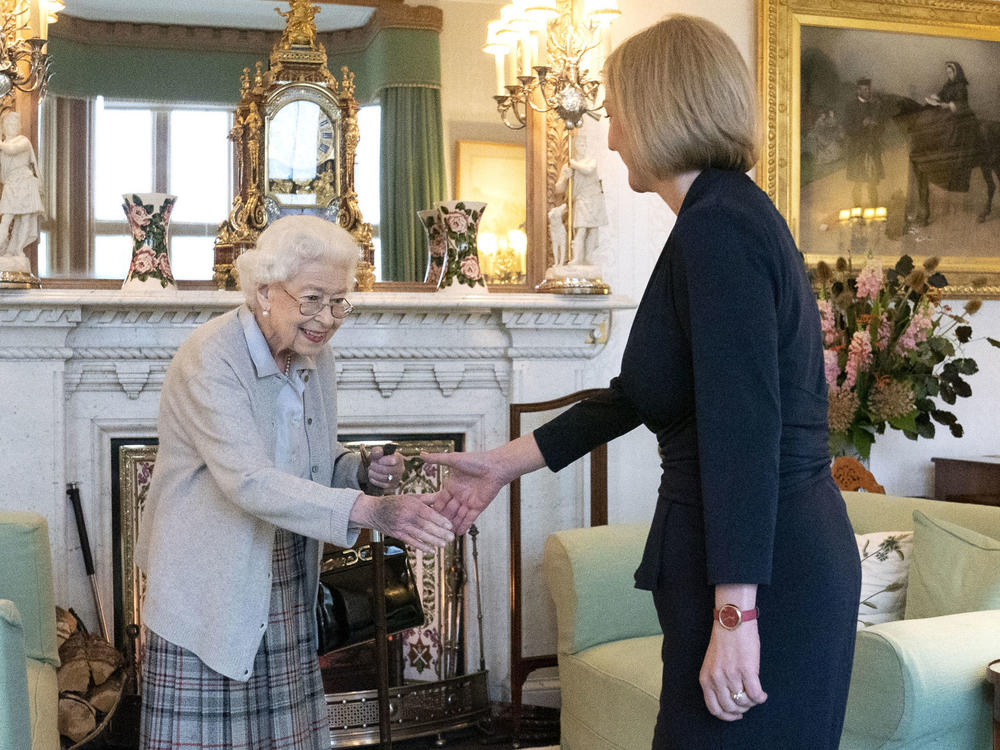 Queen Elizabeth II welcomes Liz Truss on Tuesday during an audience at Balmoral, Scotland, where the monarch invited the newly elected leader of the Conservative Party to become prime minister and form a new government.