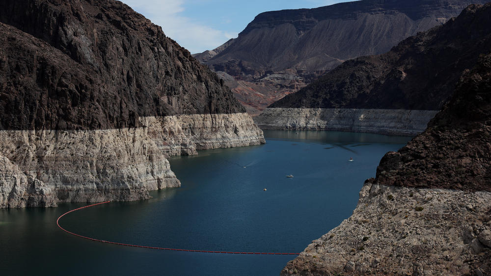 A bleached 'bathtub ring' is visible on the banks of Lake Mead near the Hoover Dam last month. The ring is a stark indicator of how far the water level has fallen in the past two decades or so.
