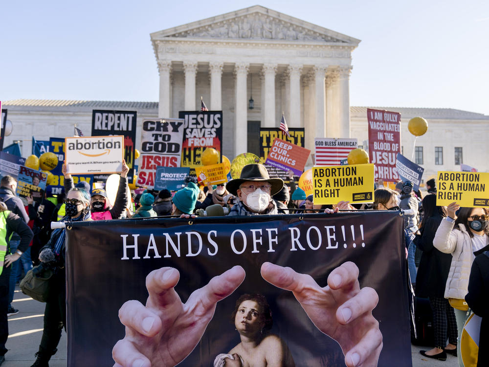 Abortion rights advocates and anti-abortion protesters demonstrate in front of the U.S. Supreme Court on Dec. 1, 2021. Heading in the 2022 midterm elections, abortion leads as the top issue for Democrats. For Republicans, it is inflation. For independents, inflation also tops and abortion ranks second.