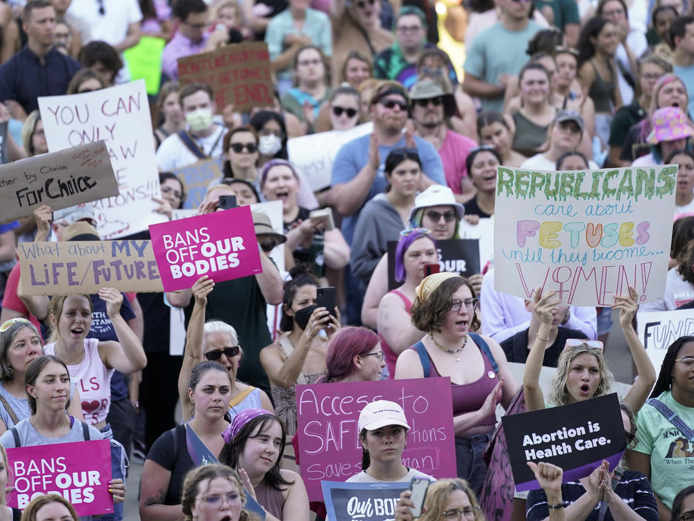 Abortion rights protesters attend a rally outside the state Capitol in Lansing, Mich., on June 24, following the U.S. Supreme Court's decision to overturn Roe v. Wade.