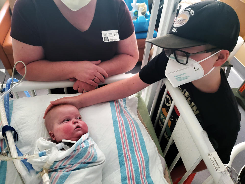 Bennett Markow looks to his big brother, Eli (right), during a family visit at UC Davis Children's Hospital in Sacramento. Bennett was born four months early, in November 2020.