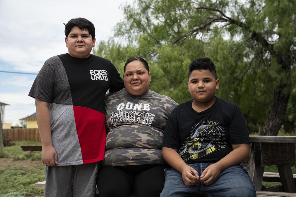 Yuri De Luna with her sons Emmanuel and Eloyd.