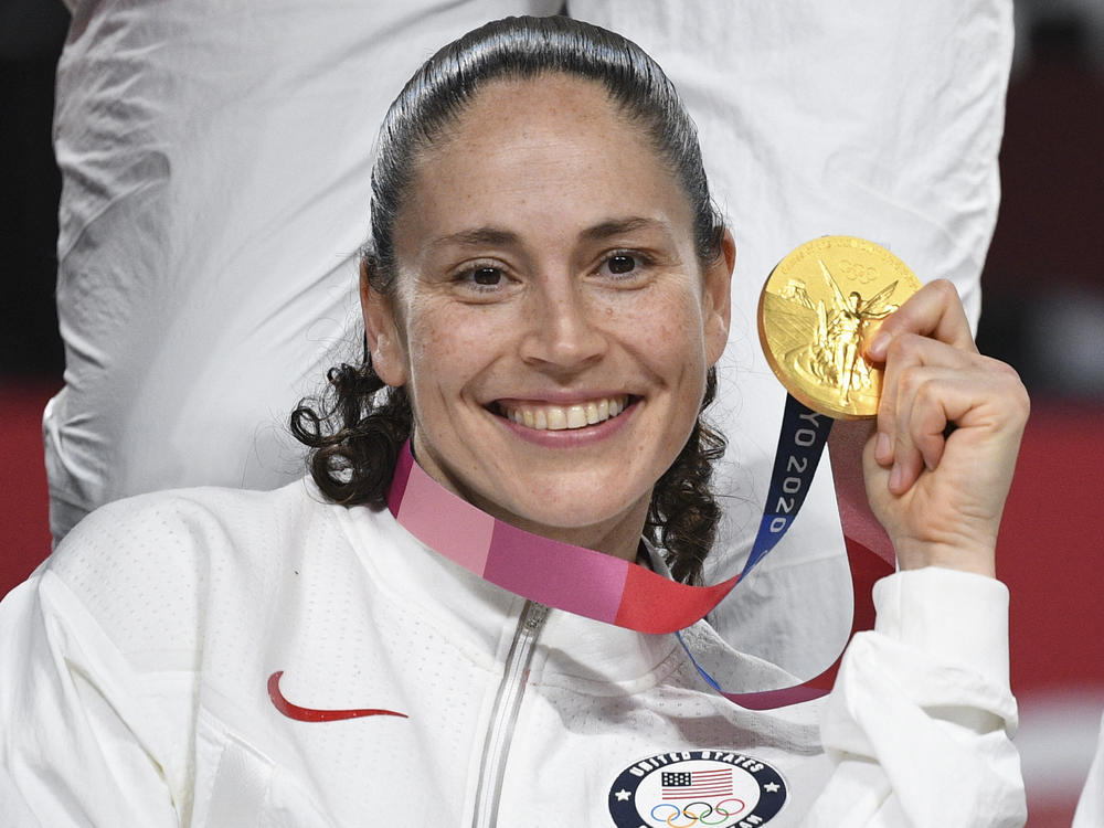 Bird poses with her gold medal at the Tokyo 2020 Olympic Games last August.