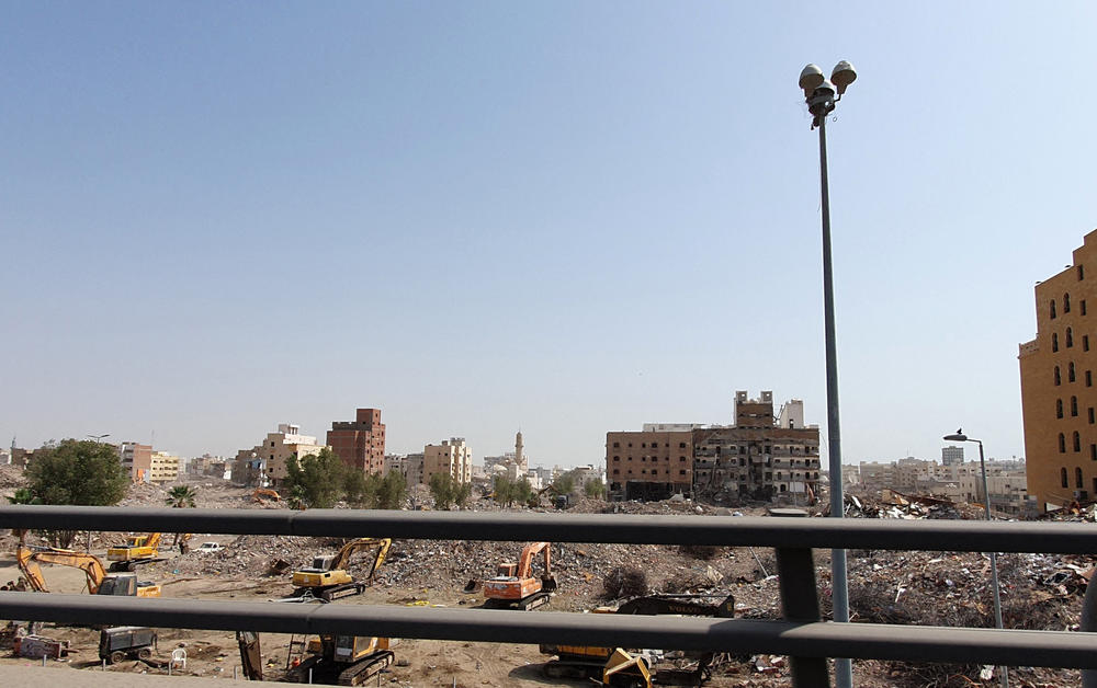 Excavators demolish buildings on March 14 in Jeddah.