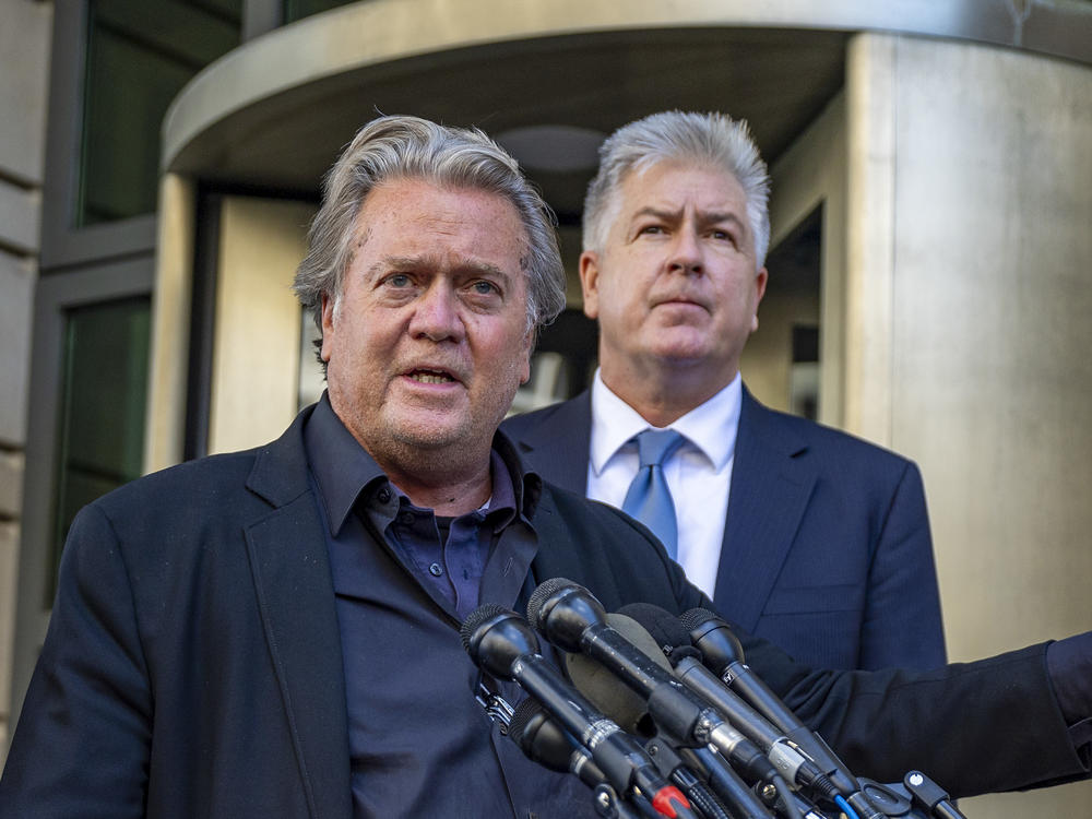 Steve Bannon speaks to the media as his lawyer Matthew Evan Corcoran listens after his trial for contempt of Congress began at the U.S. District Courthouse on July 19 in Washington, D.C.