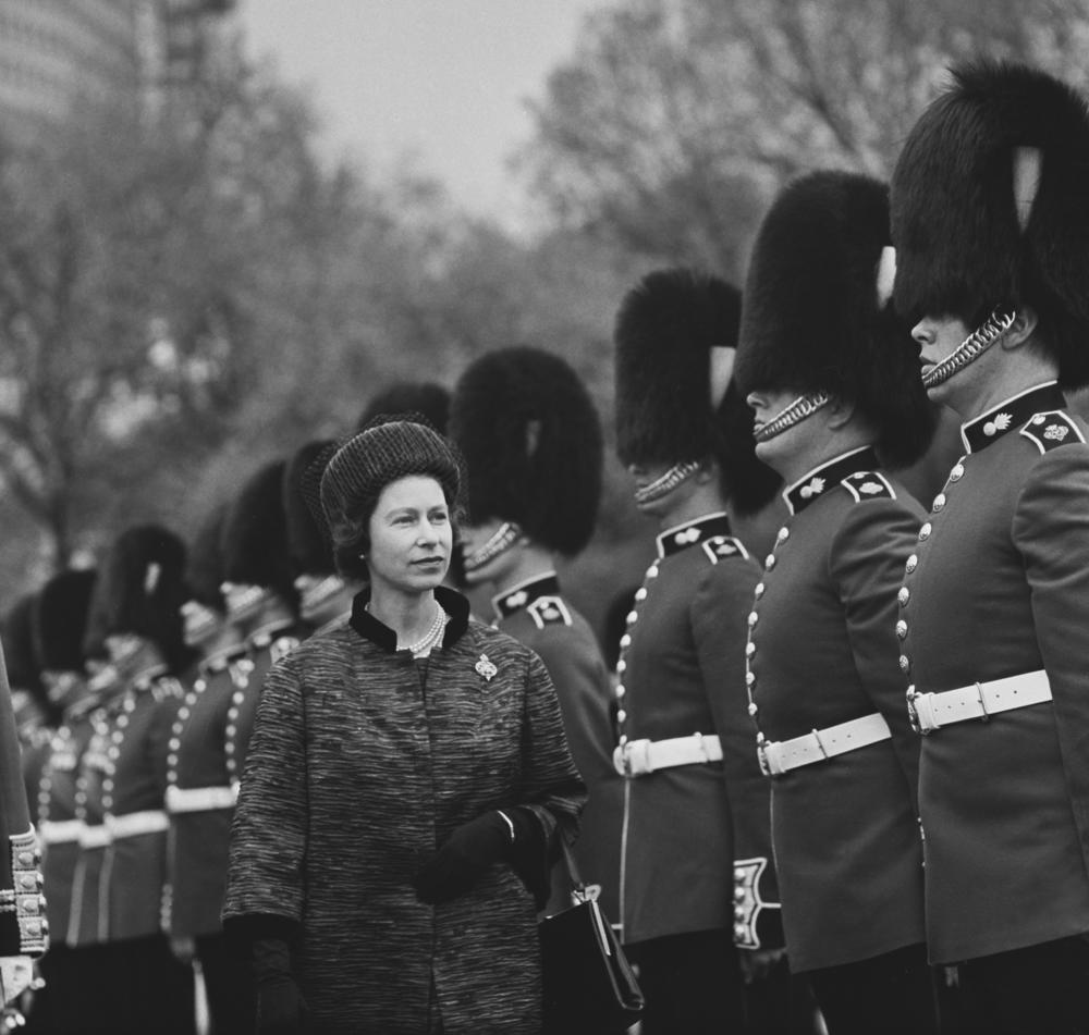 <strong>May 17, 1962</strong>: Queen Elizabeth II inspects the Grenadier Guards during a military inspection in the gardens of Buckingham Palace in London, England.