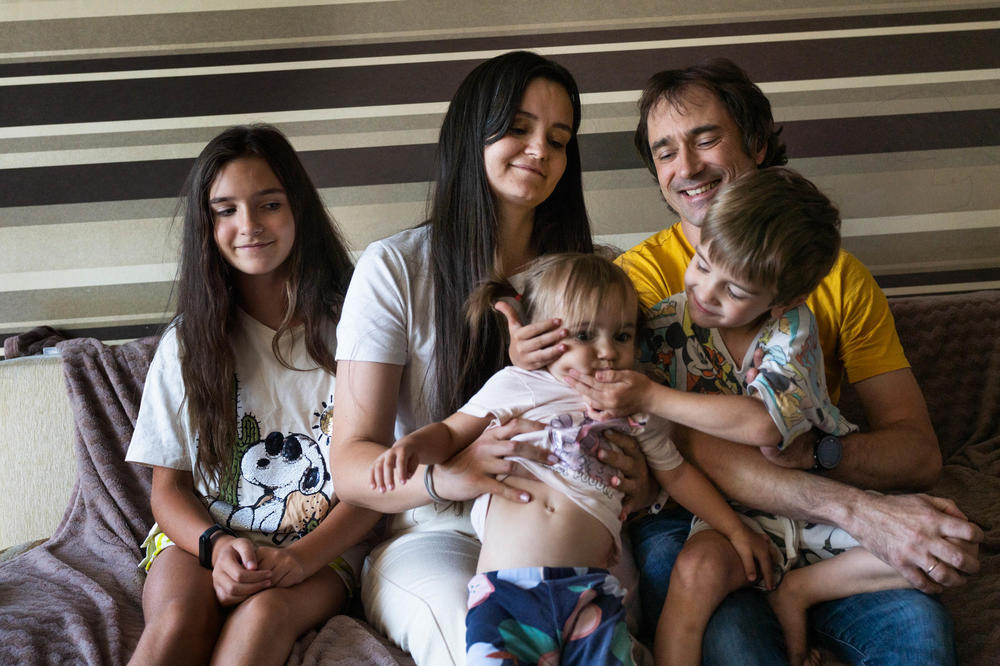 Svitlana and Serhii Sheremet with their children Vera (left), Marina, and Boris.