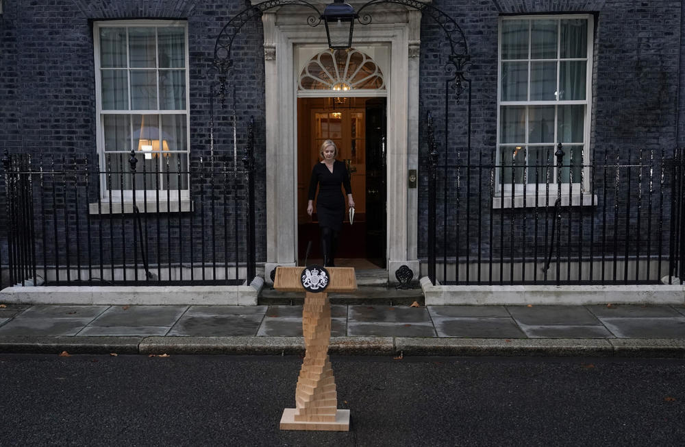 British Prime Minister Liz Truss prepares to deliver a statement regarding the death of Queen Elizabeth II outside Downing St. in London on Thursday. Elizabeth, Britain's longest-reigning monarch and a rock of stability across much of a turbulent century, died Thursday after 70 years on the throne. She was 96.