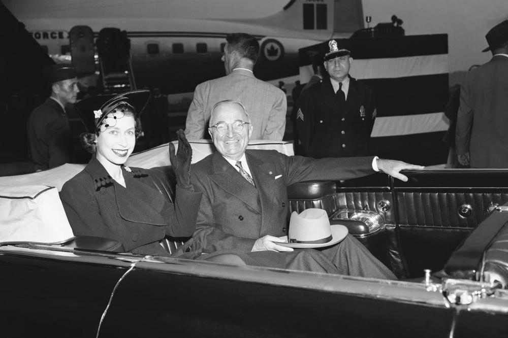 Princess Elizabeth and President Harry Truman smile from an open auto at National Airport on Oct. 31, 1951 in Washington, D.C.