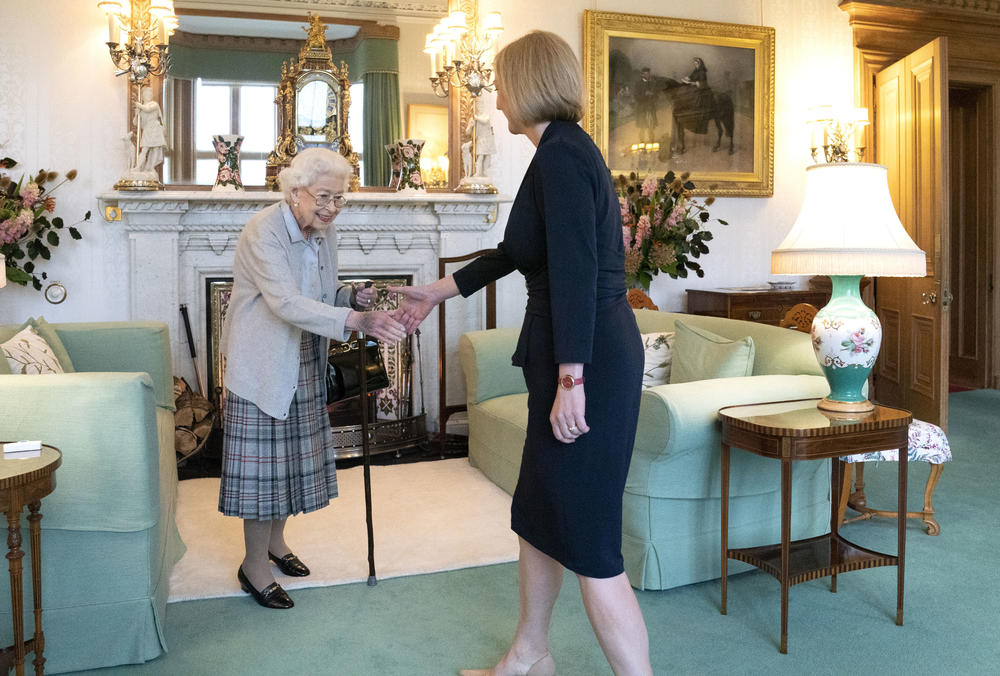 Queen Elizabeth greets newly elected leader of the Conservative Party Liz Truss as she arrives at Balmoral Castle for an audience where she will be invited to become Prime Minister and form a new government on Sept. 6 in Aberdeen, Scotland.