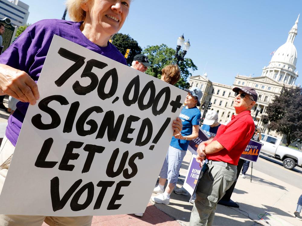 Abortion rights supporters gather outside the Michigan Capitol in Lansing, Mich., during a rally on September 7, 2022.