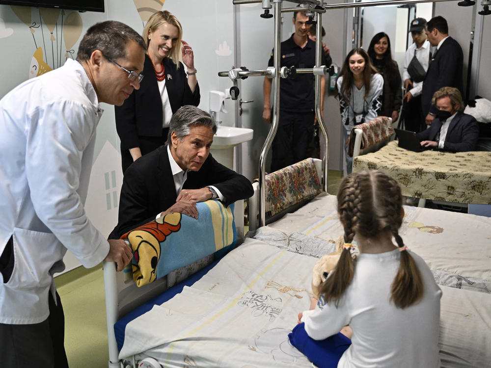 U.S. Secretary of State Antony Blinken talks with Marina, 6, from Ukraine's Kherson region, during his visit to a children's hospital in Kyiv on Thursday.