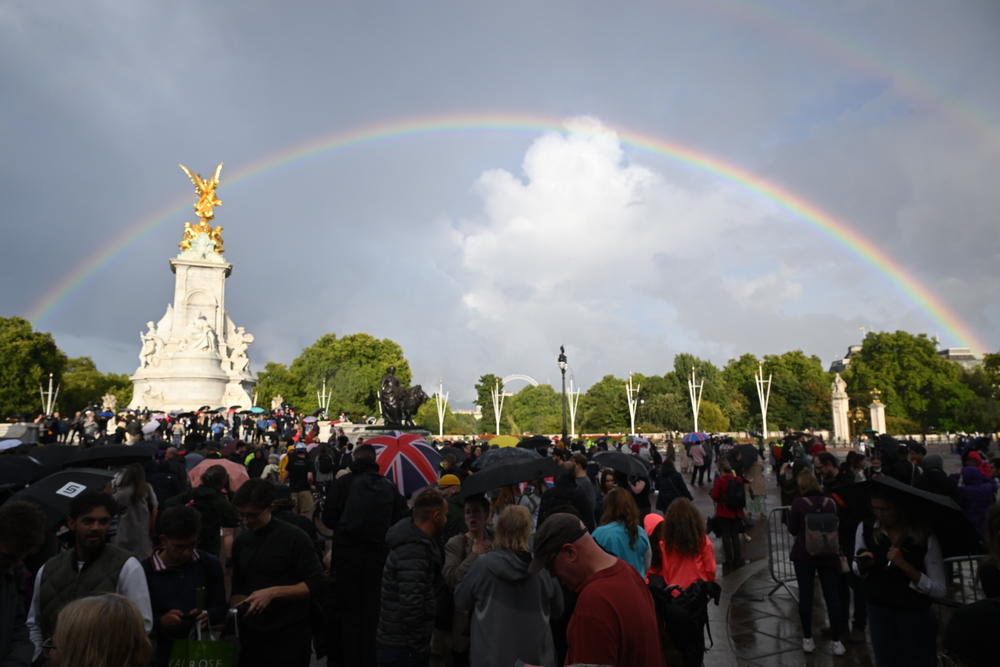 Mourners gather at Buckingham Palace after Thursday's announcement that Queen Elizabeth II has died.