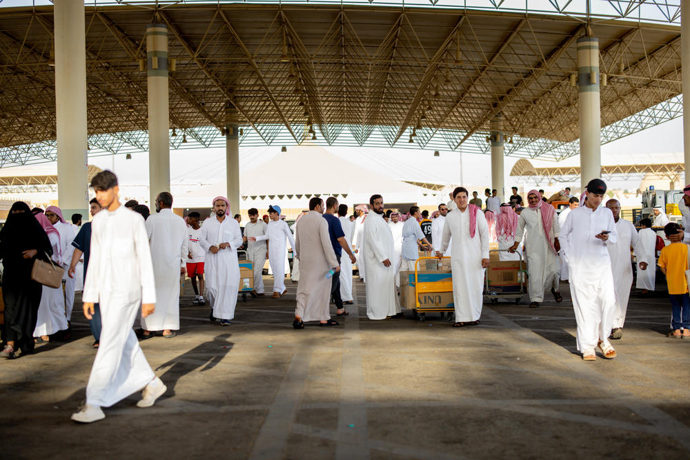 Customers and vendors at the date festival in Buraydah, Saudi Arabia, on Aug. 3, 2022. Organizers say the festival attracts date producers from around the world.