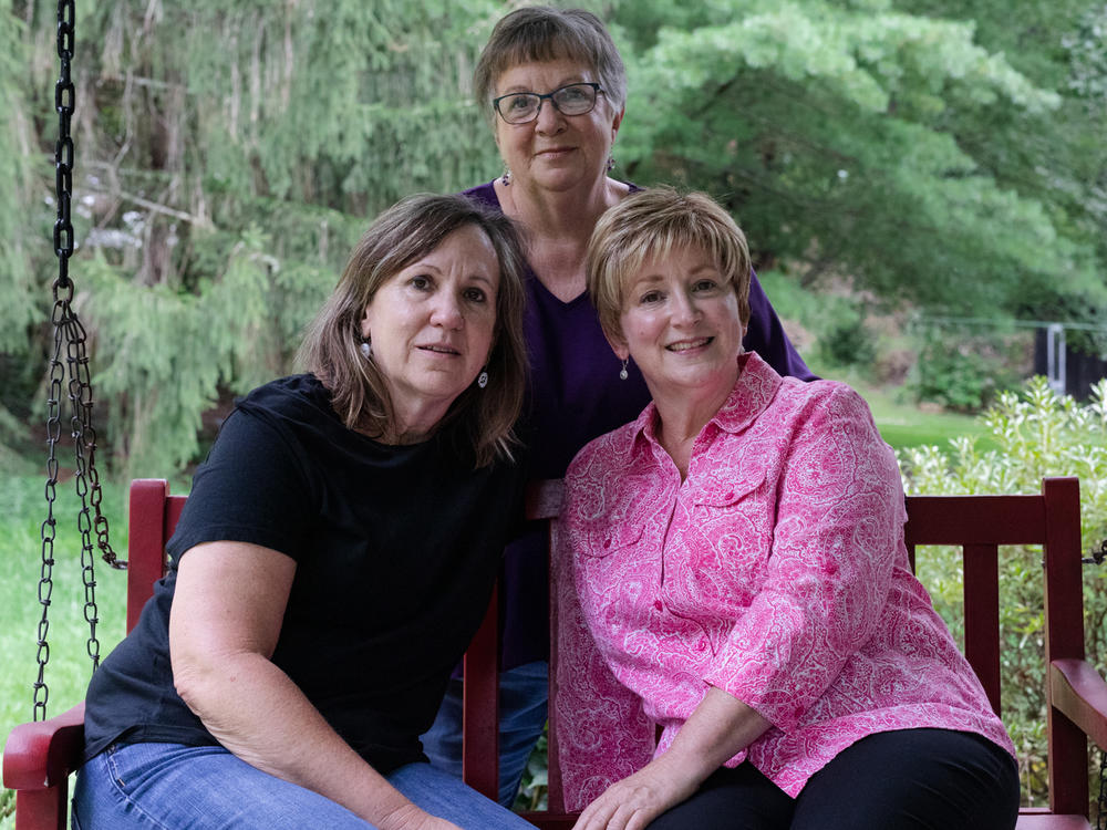 Karen Douthitt (left) and her two of her older sisters, Susie Gilliam (center), and June Ward (right) each took a test for the genetic mutation presenilin 1 after their mom got Alzheimer's disease in her early 60s. Each child of a parent with this mutation has a 50% chance of inheriting it.