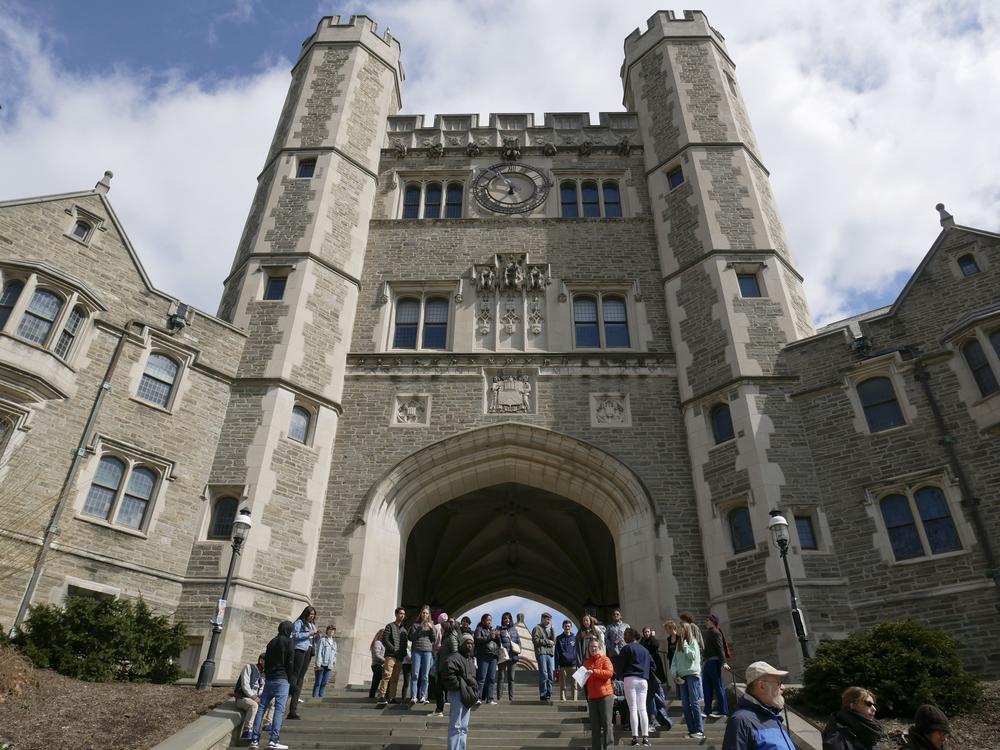 In this April 5, 2018, file photo, people walk through the Princeton University campus in Princeton, N.J.