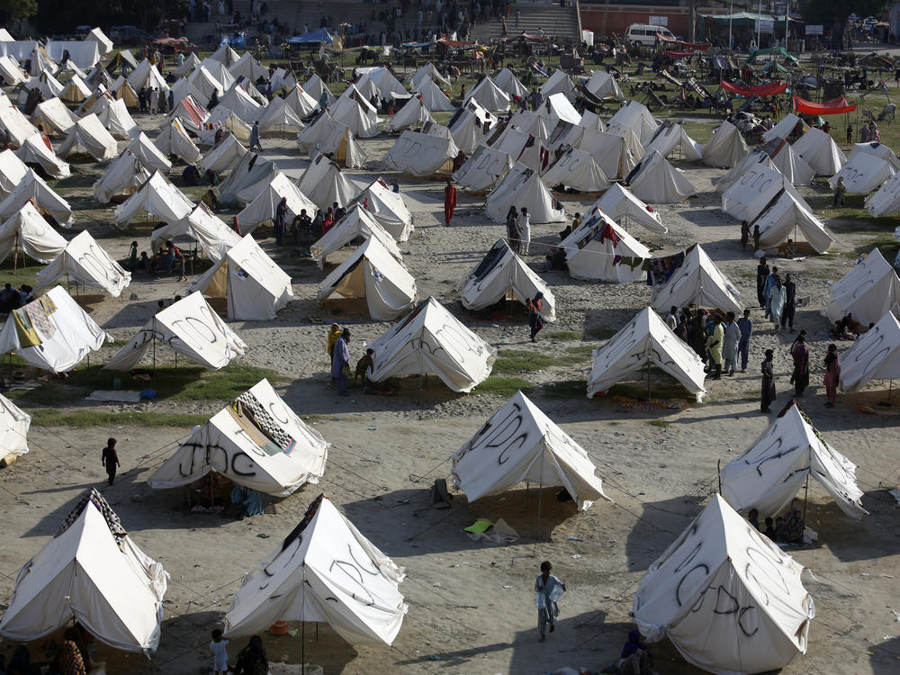 Temporary housing is constructed for flood victims, in Larkana District, of Sindh, Pakistan, Thursday, Sept. 8, 2022.