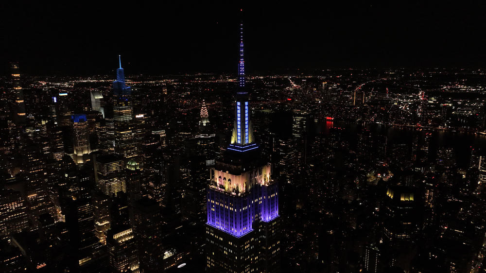 The Empire State Building in New York City lit up in purple and sparkled in silver in tribute to Queen Elizabeth II on Thursday.