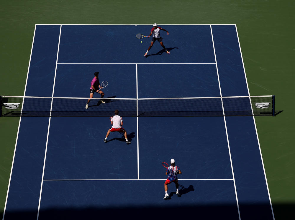 Rajeev Ram and Joe Salisbury return a shot against Neal Skupski and Wesley Koolhof during their Men's Doubles Final match on Friday at the U.S. Open.