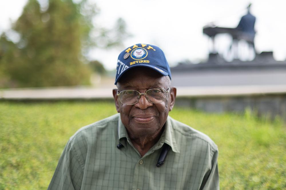 Johnnie Armstrong, sitting in front of the Ray Charles Memorial on Aug. 29, 2022, says he has voted in Albany, Ga., since 1955.