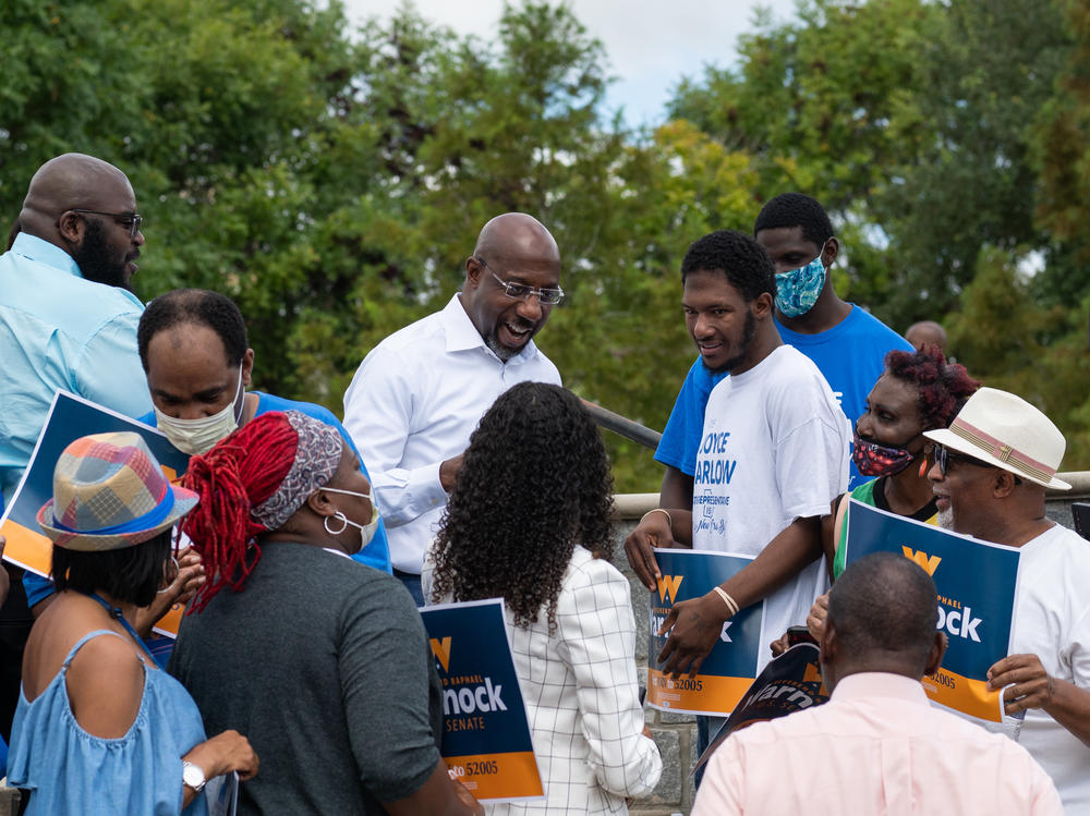 U.S. Sen. Raphael Warnock's campaign bus tour in Albany, Ga., on Aug. 29, 2022.