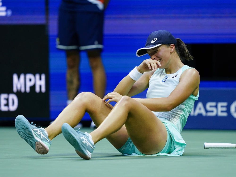 Iga Swiatek of Poland reacts after defeating Ons Jabeur of Tunisia to win the women's singles final of the U.S. Open tennis championships on Saturday.