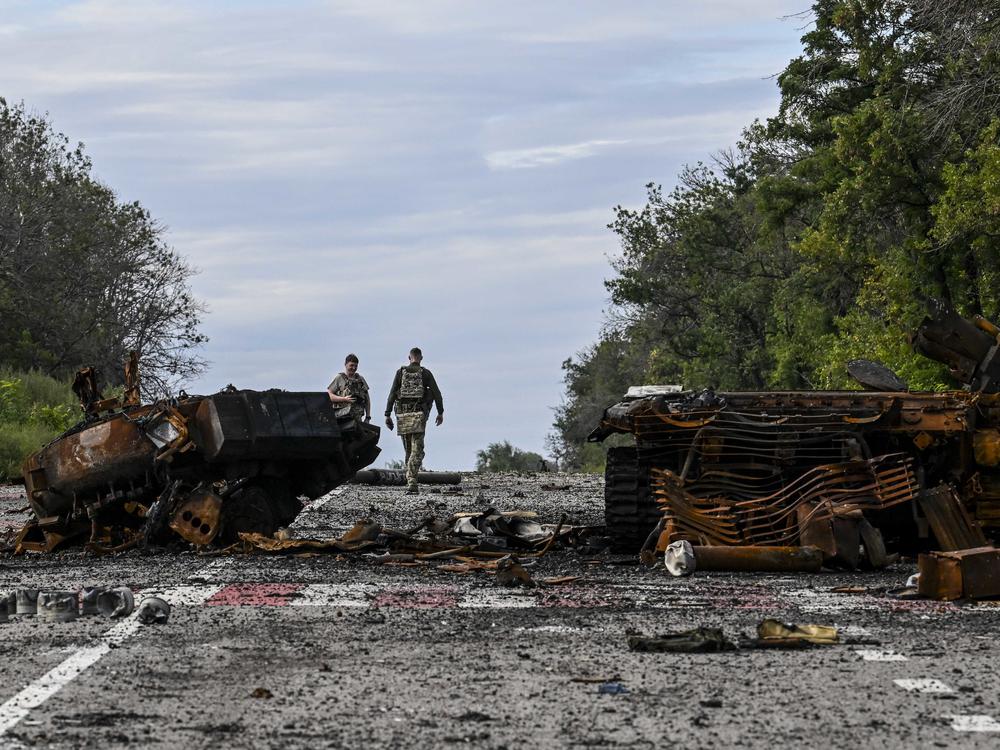 Destroyed armored vehicles litter the road in Balakliya, Kharkiv region, on Saturday.