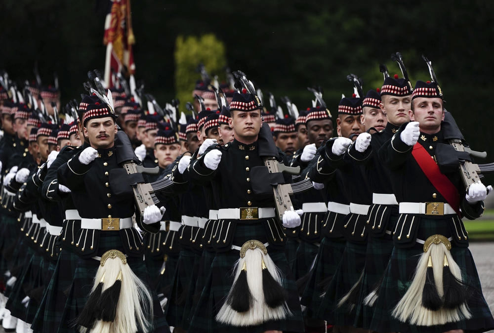 The guard of honour from the King's Bodyguard for Scotland (Royal Company of Archers) arrive at the Palace of Holyrood House ahead of the hearse carrying the coffin of Queen Elizabeth II.