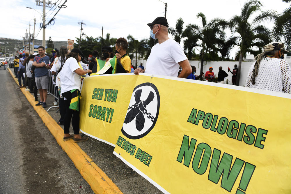 People calling for slavery reparations protest outside the entrance of the British High Commission during the visit of the Duke and Duchess of Cambridge in Kingston, Jamaica, earlier this year.
