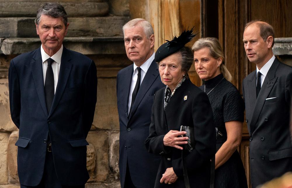Vice Admiral Timothy Laurence (left) Britain's Prince Andrew, Duke of York (second left), Britain's Princess Anne, Princess Royal (center), Britain's Sophie, Countess of Wessex (second right) and Britain's Prince Edward, Earl of Wessex await the arrival of the hearse carrying the coffin of the late Queen Elizabeth II.
