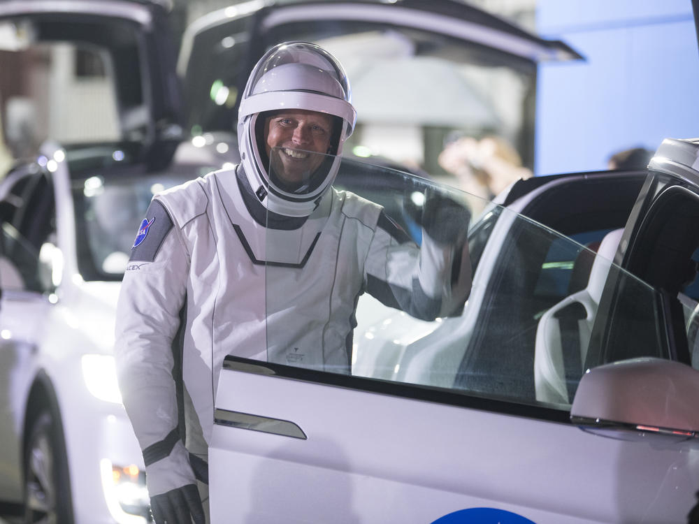 NASA astronaut Robert Hines climbed into a Tesla before boarding a SpaceX launch in April 2021.