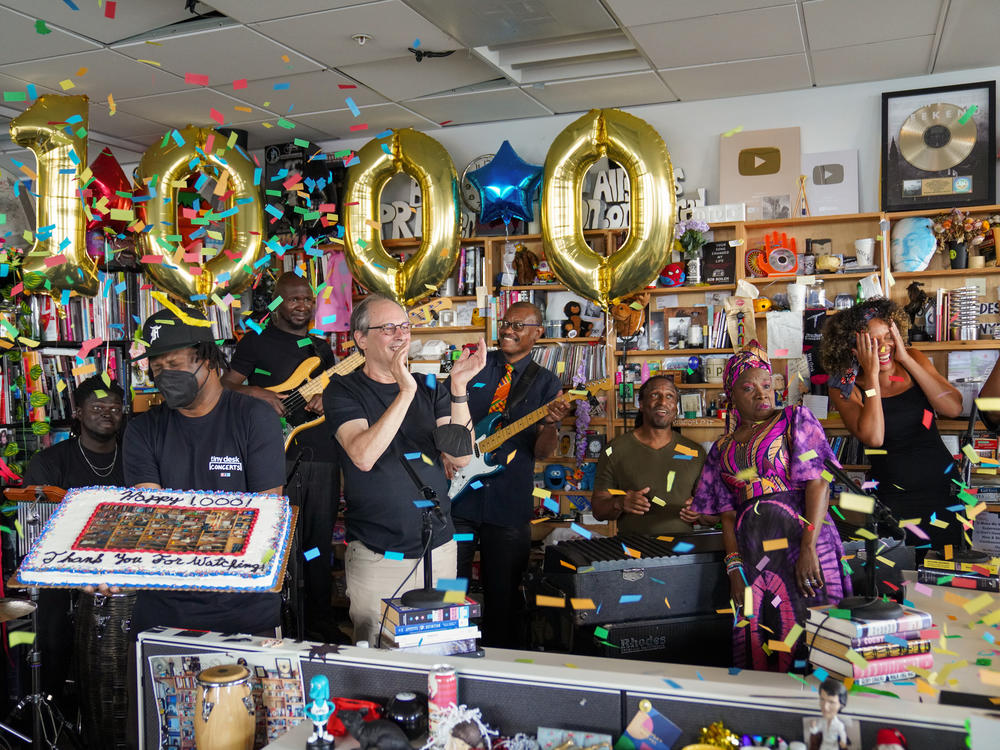 When you hit the 1,000 mark, there must be cake. Tiny Desk creator and creative director Bob Boilen (in black shirt and beige pants) and the Tiny Desk crew celebrate this milestone with Angélique Kidjo and her band. The first Tiny Desk Concert was in 2008 and featured folk singer Laura Gibson.