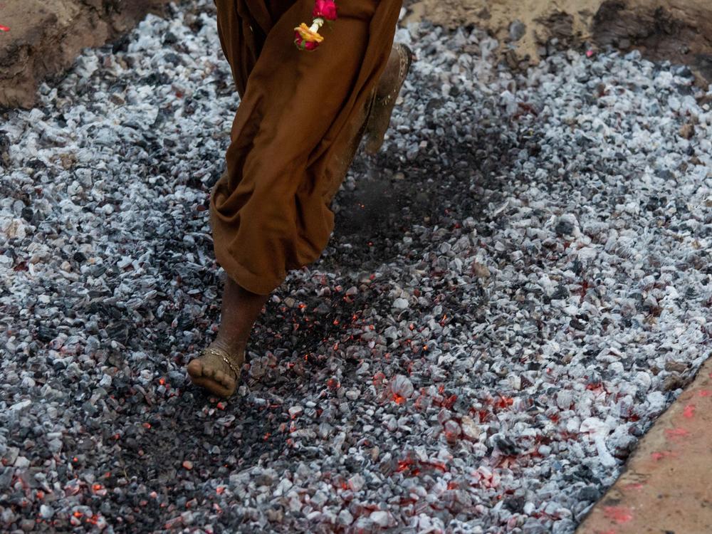 A Hindu devotee walks over hot coals while taking part in the Yankin Moekaung fire walk festival in Yangon, Myanmar.