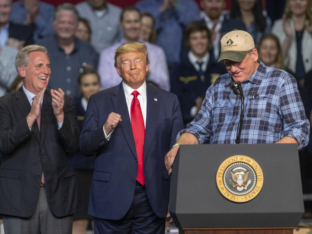 A farmer praises President Trump as House Minority Leader Kevin McCarthy looks on during a legislation signing rally with local farmers, in February 2020 in Bakersfield, Calif.