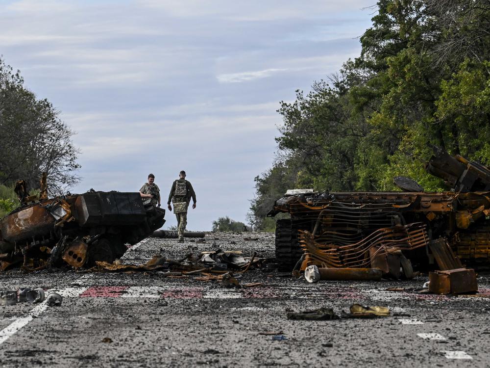 Destroyed armored vehicles litter the road in Balakliya, in Ukraine's Kharkiv region, on Saturday. Ukrainian forces said recaptured key towns and villages in the country's northeast.