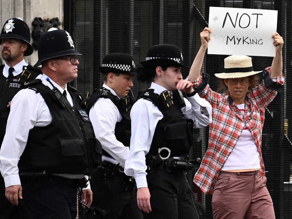 An anti-monarchy demonstrator protests outside Palace of Westminster in central London on Monday. A number of arrests in the U.K. are sparking questions about freedom of speech.