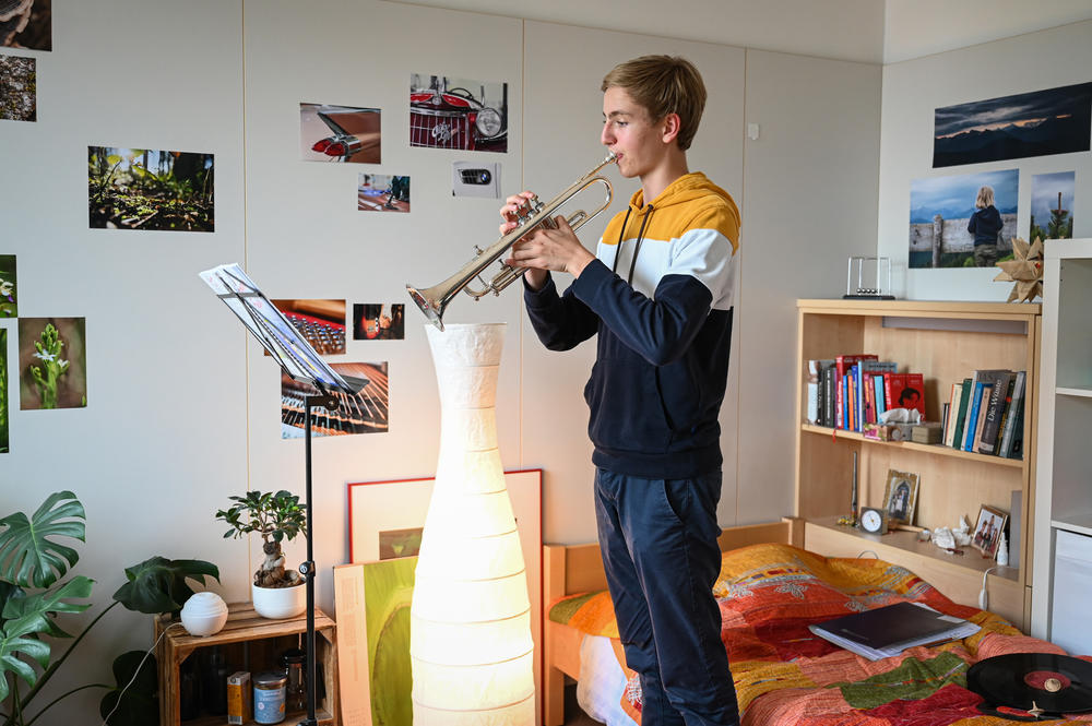Maximilian Steiner practices his trumpet in his room at choir boarding school on July 15, 2021. He joined the school starting in first grade.