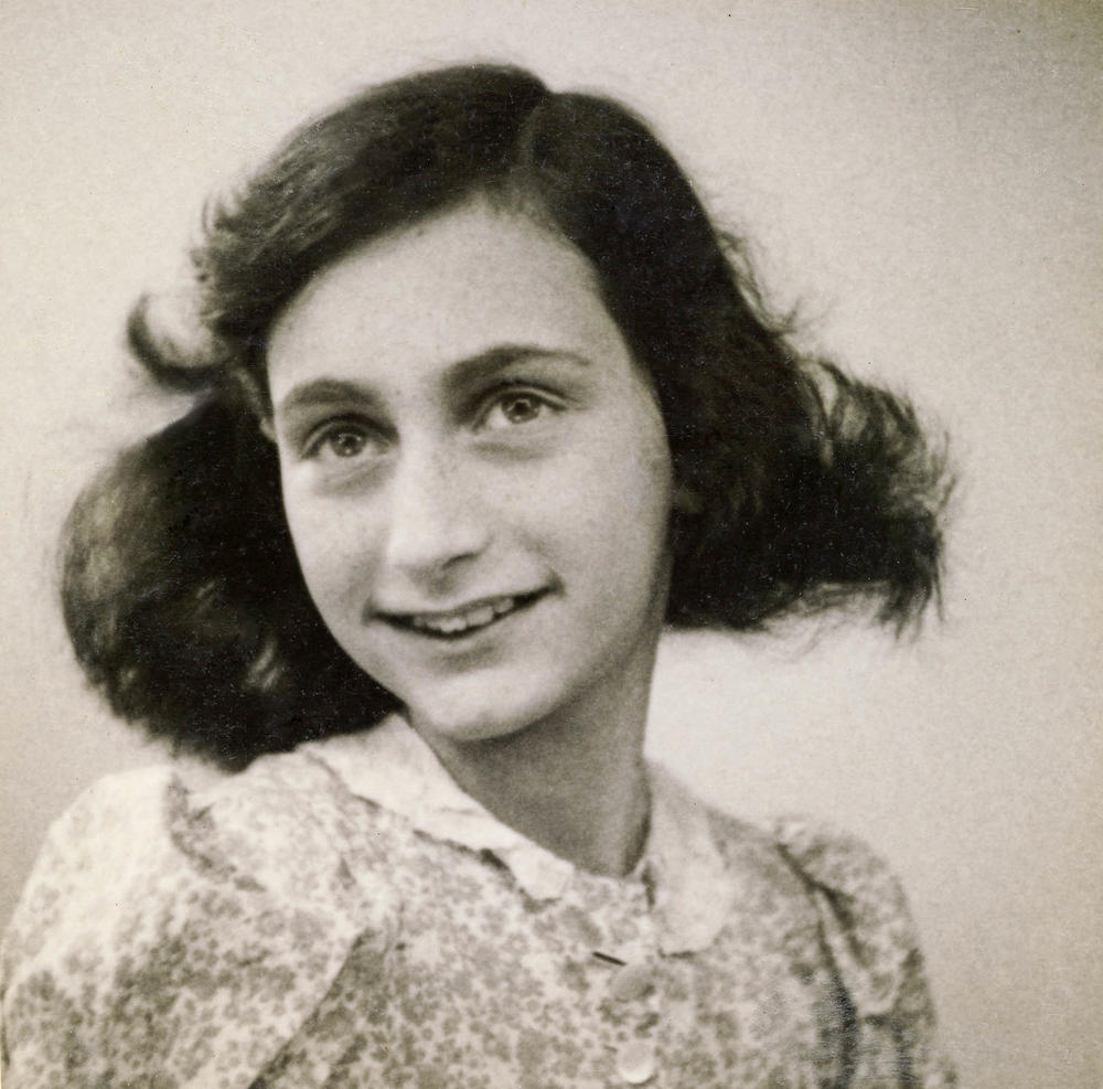 The passport photo of Anne Frank from May 1942. She and her family hid from the Nazis until they were betrayed and sent to concentration camps in 1944. Only her father survived. The teen's diary is being read by Afghan girls in a secret book club.