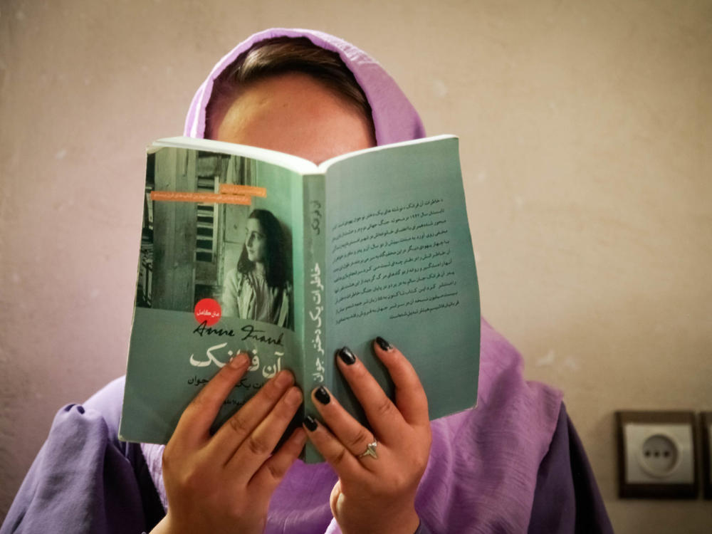 A group of teen girls in Afghanistan is reading and discussing Anne Frank's classic book in a secret book club.