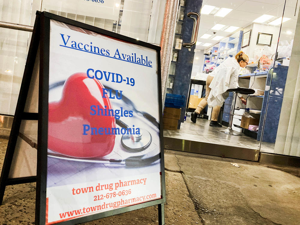 A pharmacy in New York City offers vaccines for COVID-19 and flu. Some researchers argue that the two diseases may pose similar risks of dying for those infected.
