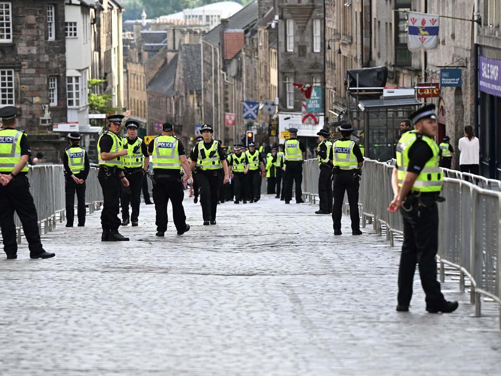 Police officers patrol in the streets of Edinburgh on Sept. 11, 2022, as preparations are made for the arrival of the coffin of Queen Elizabeth II.