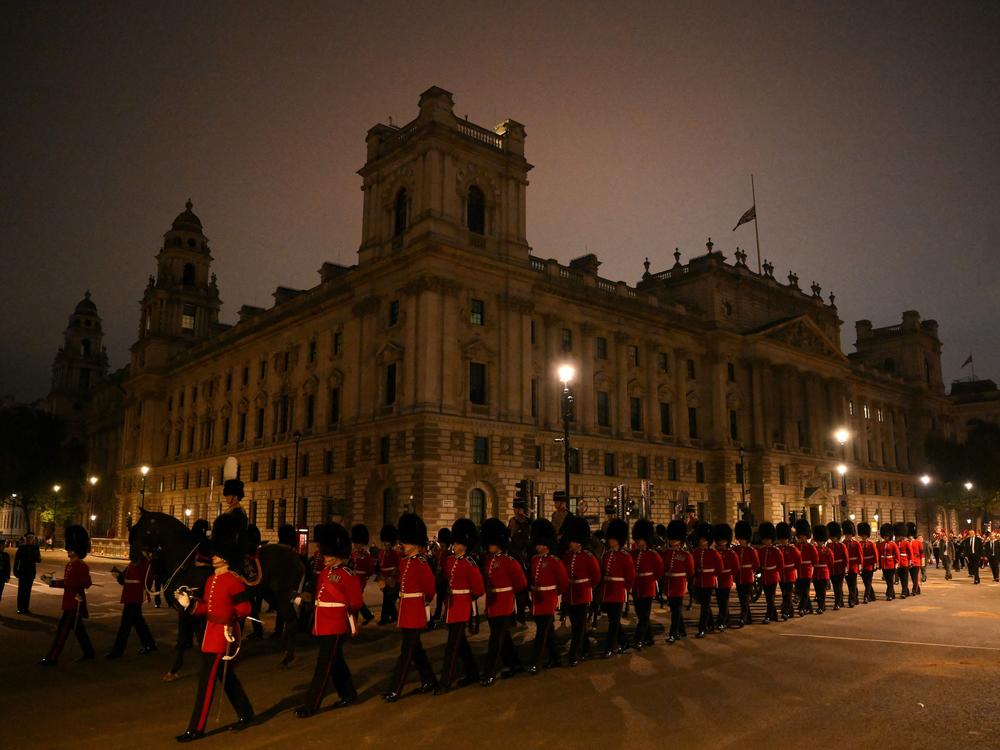 Grenadier Guards, a unit of the Household Division Foot Guards, take part in a rehearsal of the ceremonial procession of Queen Elizabeth II's coffin from Buckingham Palace to the Palace of Westminster in London.