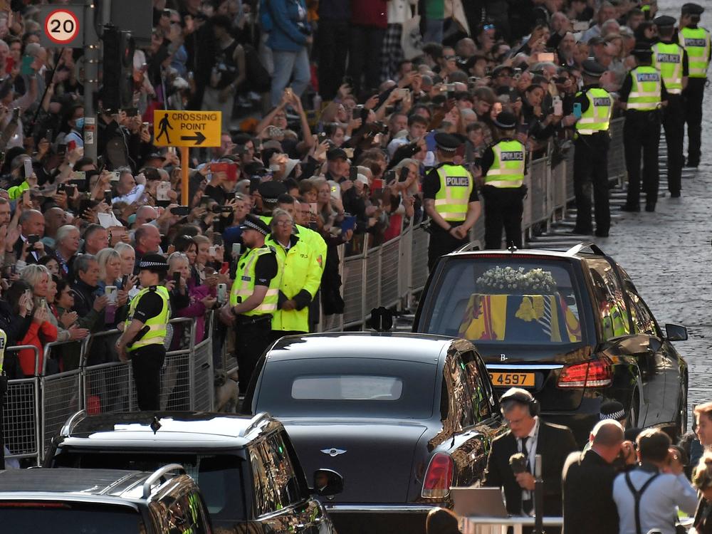 The hearse carrying the coffin of Queen Elizabeth II, leaves from from St Giles' Cathedral in Edinburgh, Scotland.