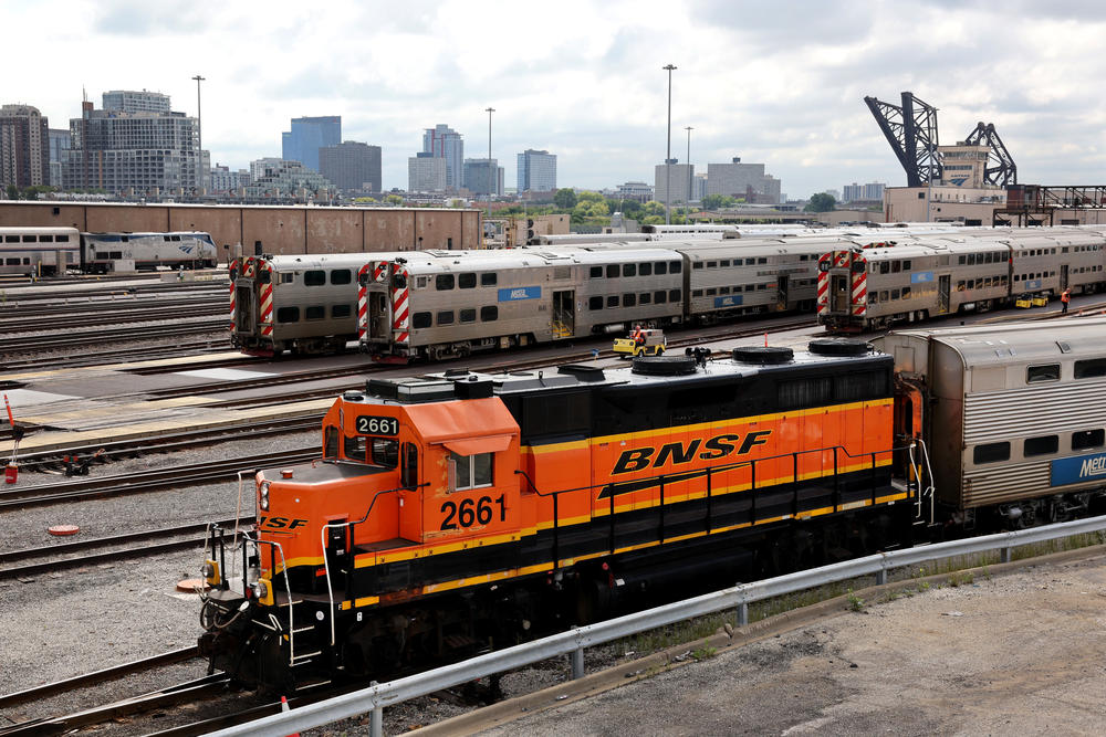 A BNSF engine pulls Metra commuter train cars at the Metra/BNSF railroad yard outside downtown Chicago on Tuesday.